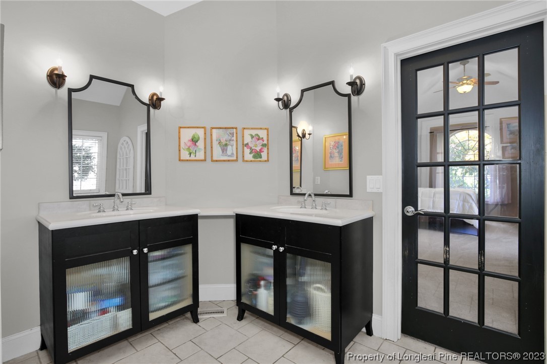 1145 Burning Tree Road Pinehurst, NC 28374 - Photo 22 of 45 a kitchen with sink and cabinets
