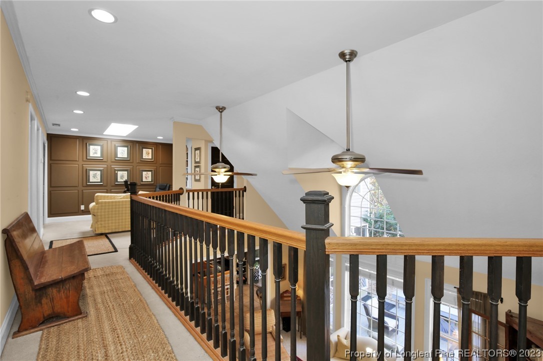 1145 Burning Tree Road Pinehurst, NC 28374 - Photo 24 of 45 a view of a hallway with furniture and stairs