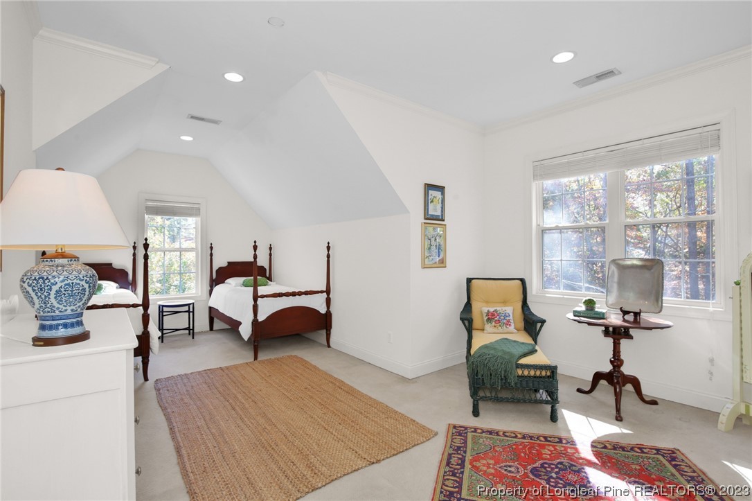 1145 Burning Tree Road Pinehurst, NC 28374 - Photo 26 of 45 a bedroom with furniture rug and window