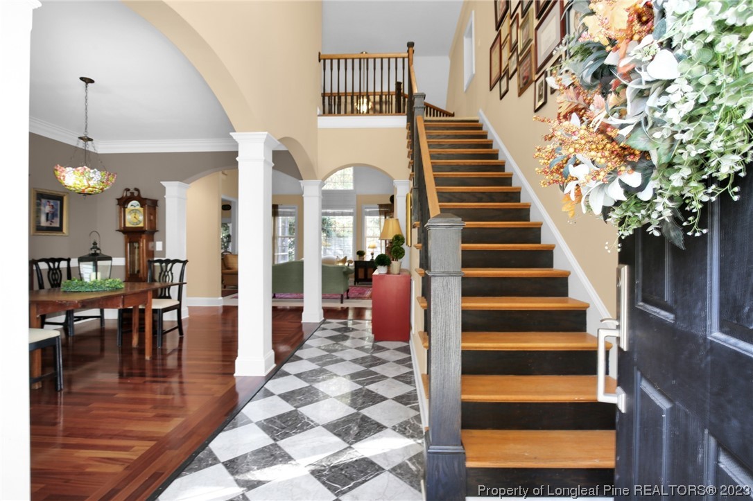 1145 Burning Tree Road Pinehurst, NC 28374 - Photo 3 of 45 a view of entryway and hall with wooden floor