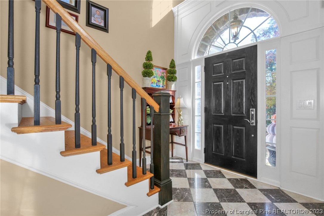 1145 Burning Tree Road Pinehurst, NC 28374 - Photo 4 of 45 a view of entryway with a front door and wooden floor