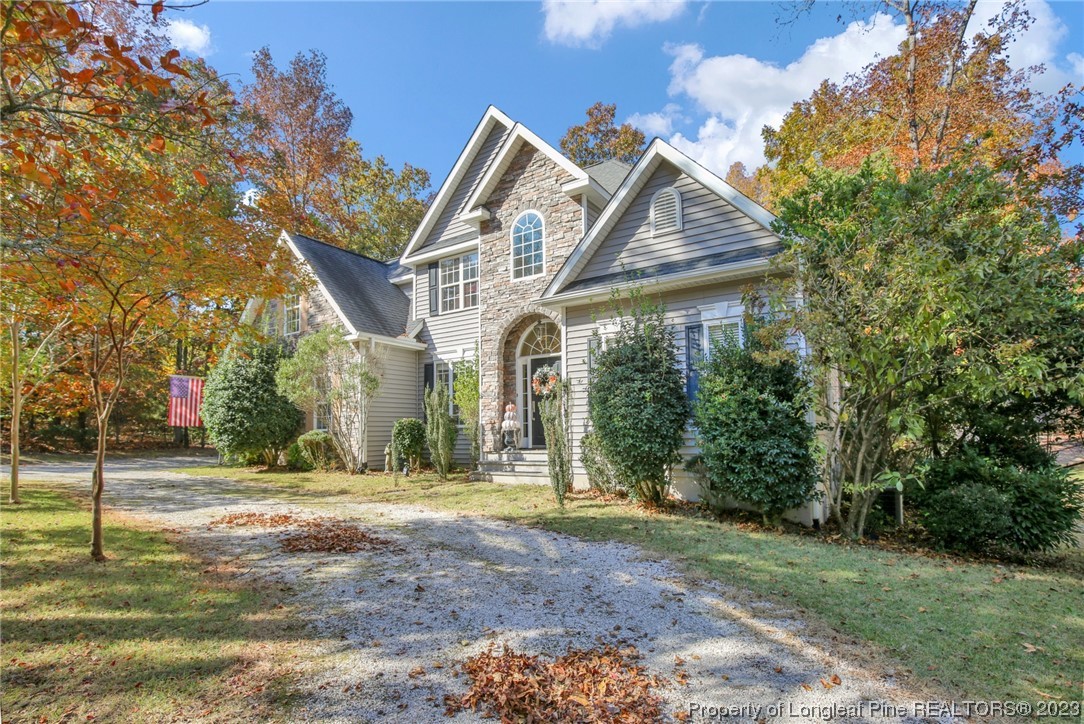 1145 Burning Tree Road Pinehurst, NC 28374 - Photo 45 of 45 a front view of a house with a yard