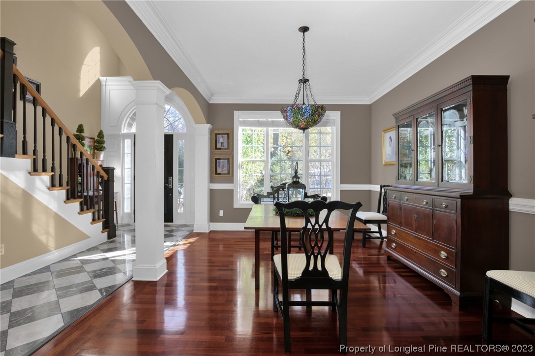 1145 Burning Tree Road Pinehurst, NC 28374 - Photo 5 of 45 a view of a dining room with furniture window and wooden floor