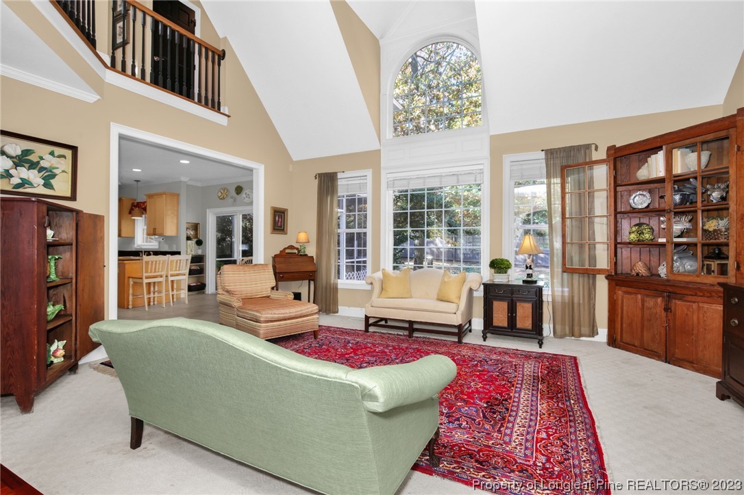 1145 Burning Tree Road Pinehurst, NC 28374 - Photo 7 of 45 a living room with furniture and a rug