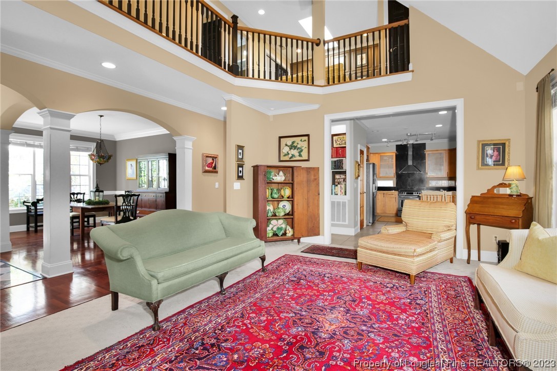 1145 Burning Tree Road Pinehurst, NC 28374 - Photo 10 of 45 a living room with furniture and a rug