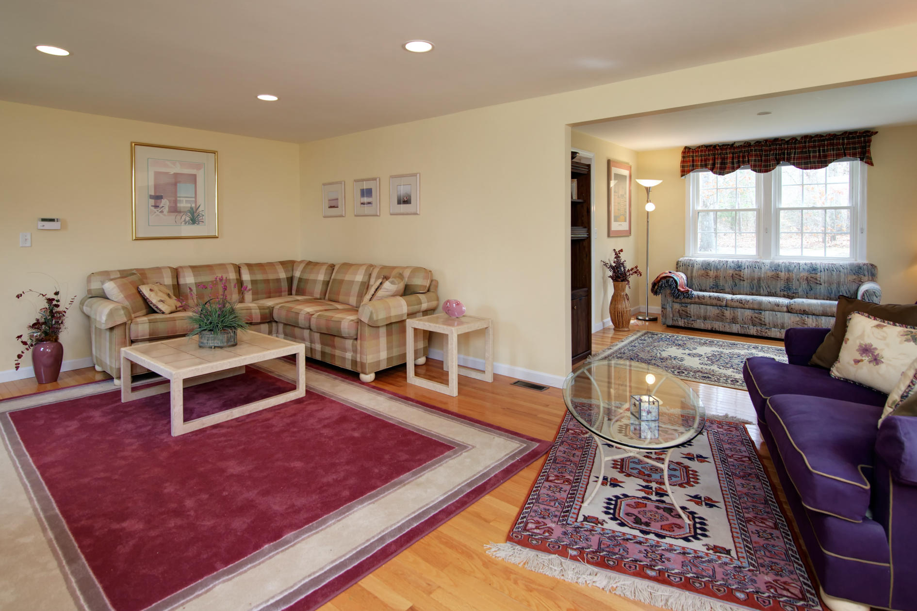 115 Holly Point Road Centerville, MA 02632 - Photo 12 of 26 a living room with furniture and a rug