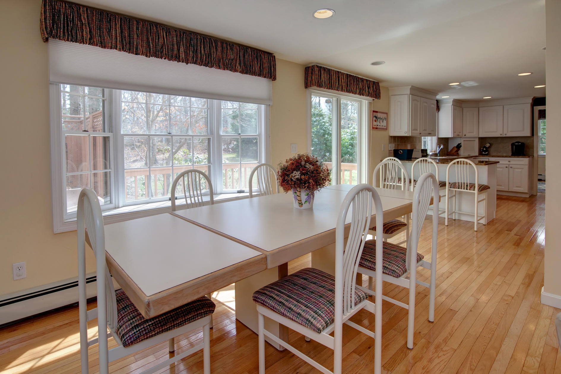 115 Holly Point Road Centerville, MA 02632 - Photo 16 of 26 a view of a dining room with furniture window and wooden floor