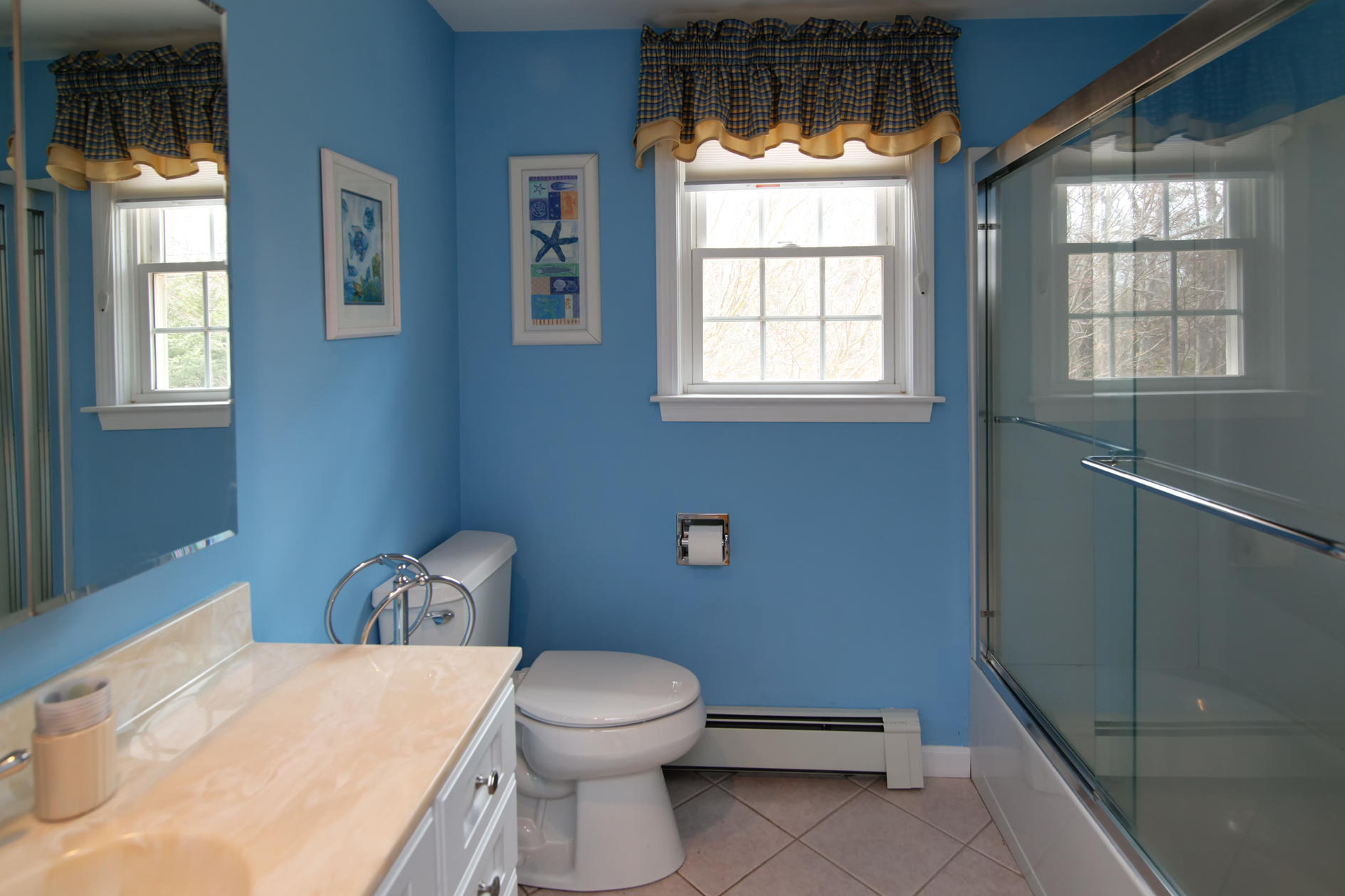 115 Holly Point Road Centerville, MA 02632 - Photo 20 of 26 a bathroom with a toilet sink and window