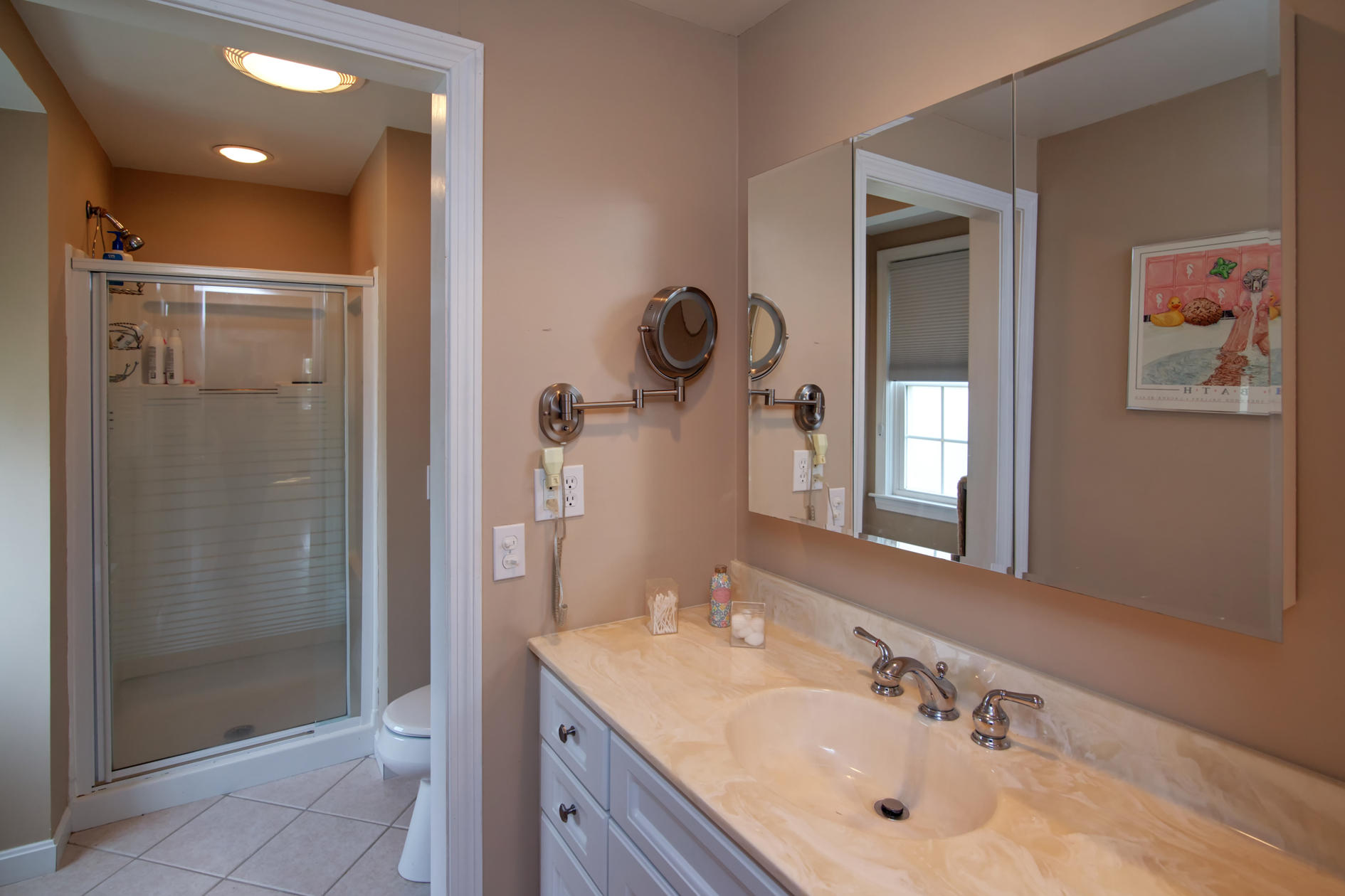 115 Holly Point Road Centerville, MA 02632 - Photo 25 of 26 a bathroom with a sink a toilet and shower