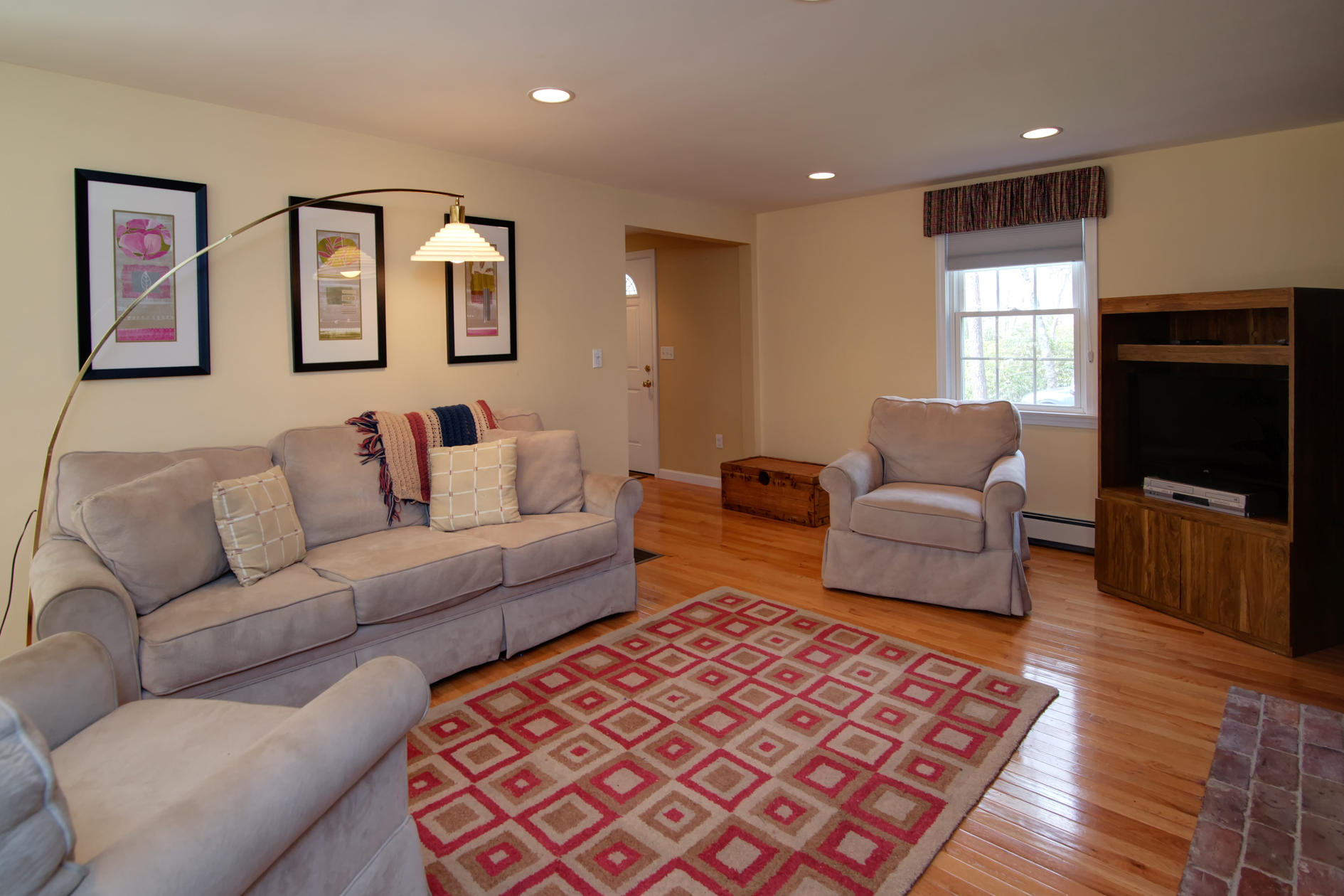 115 Holly Point Road Centerville, MA 02632 - Photo 9 of 26 a living room with furniture and a flat screen tv