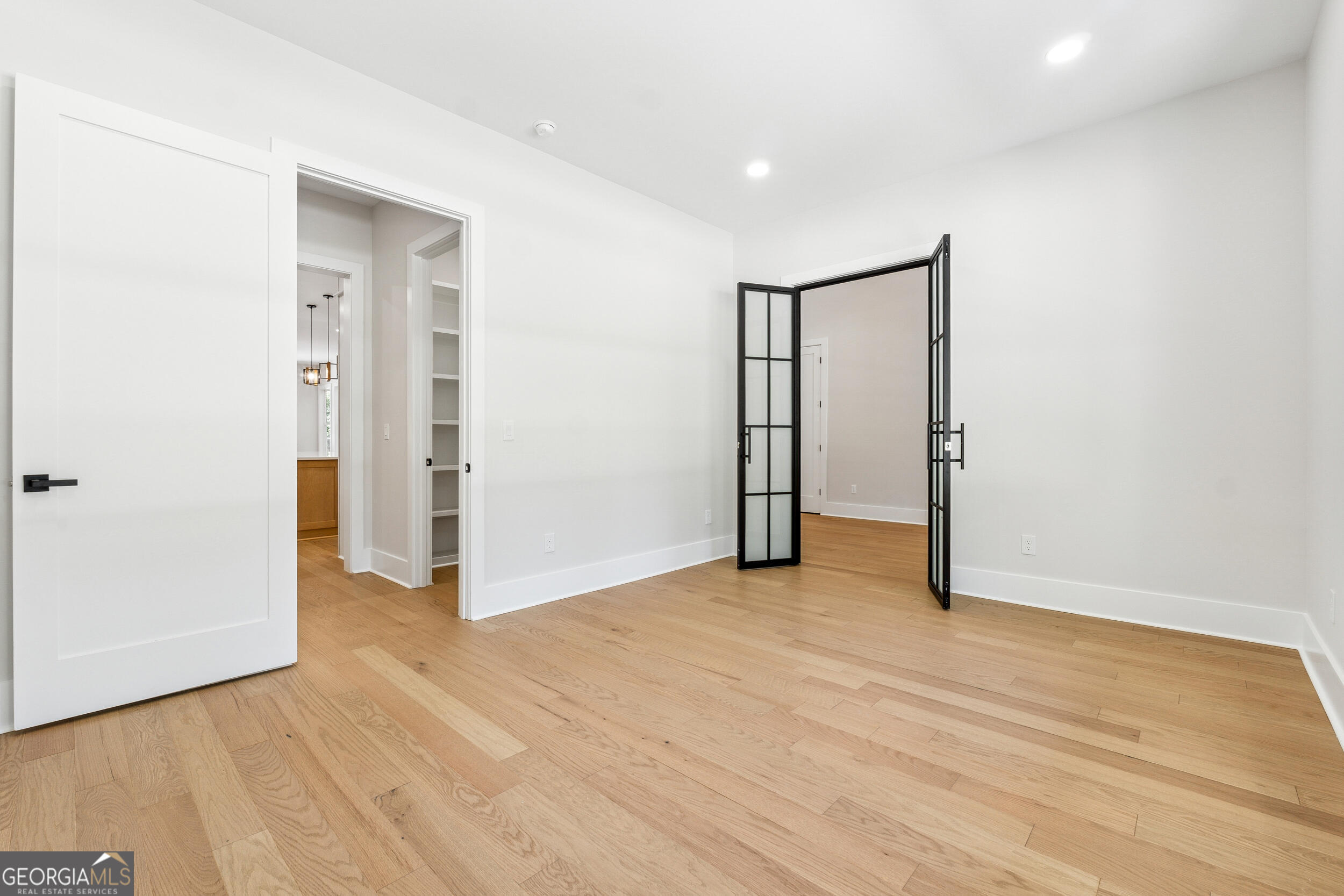 1622 Double Springs Monroe, GA 30656 - Photo 15 of 44 an empty room with wooden floor and bathroom view
