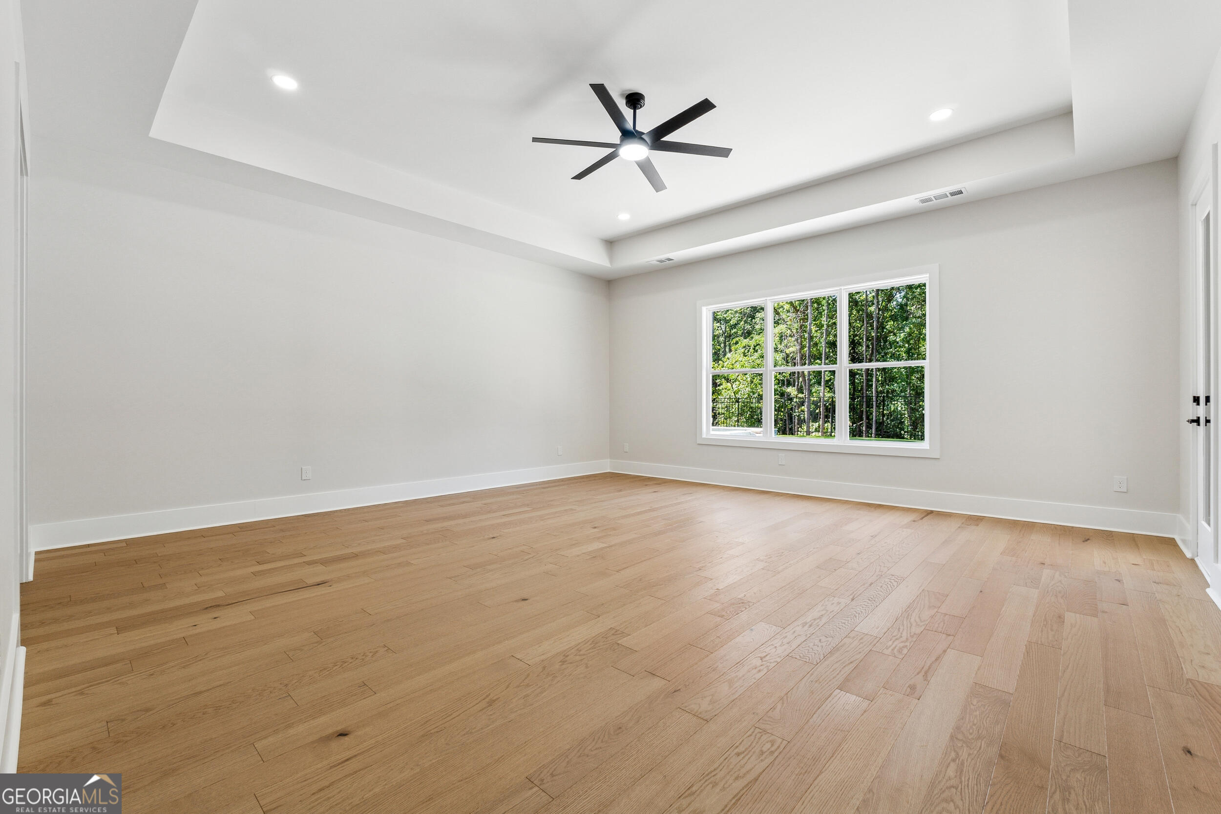 1622 Double Springs Monroe, GA 30656 - Photo 18 of 44 an empty room with wooden floor and windows