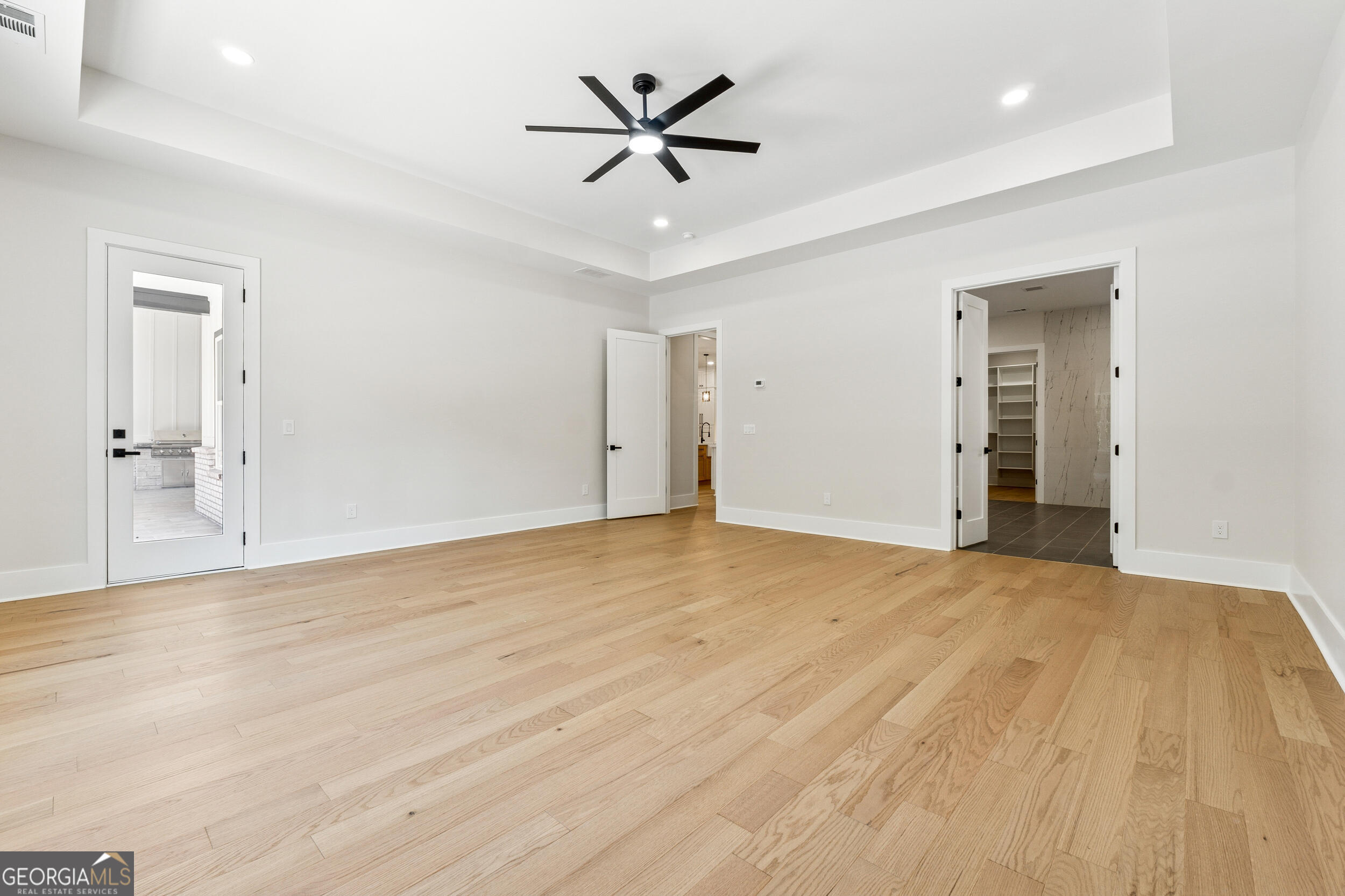 1622 Double Springs Monroe, GA 30656 - Photo 19 of 44 wooden floor in an empty room with a ceiling fan