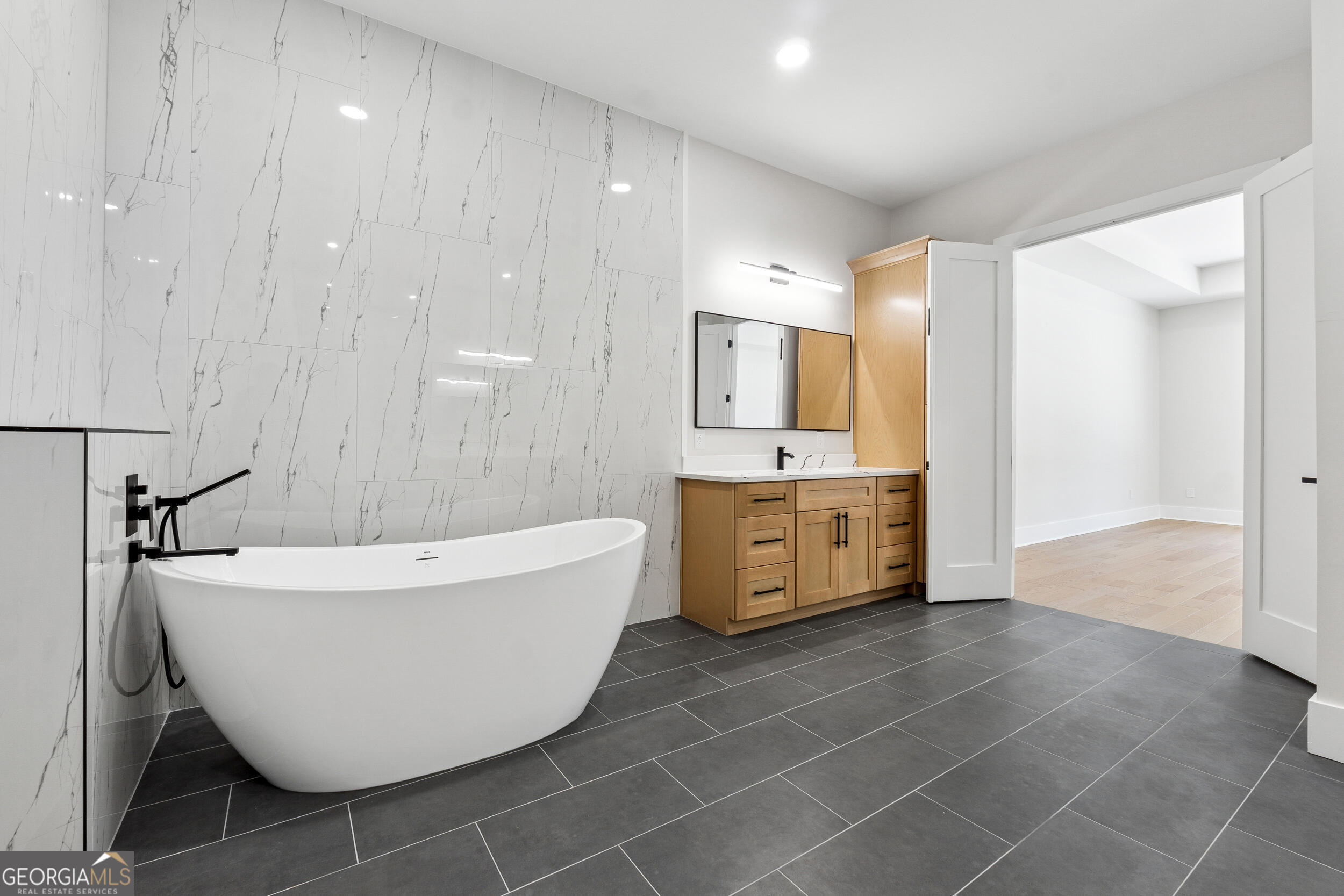 1622 Double Springs Monroe, GA 30656 - Photo 20 of 44 a bathroom with a bathtub and shower