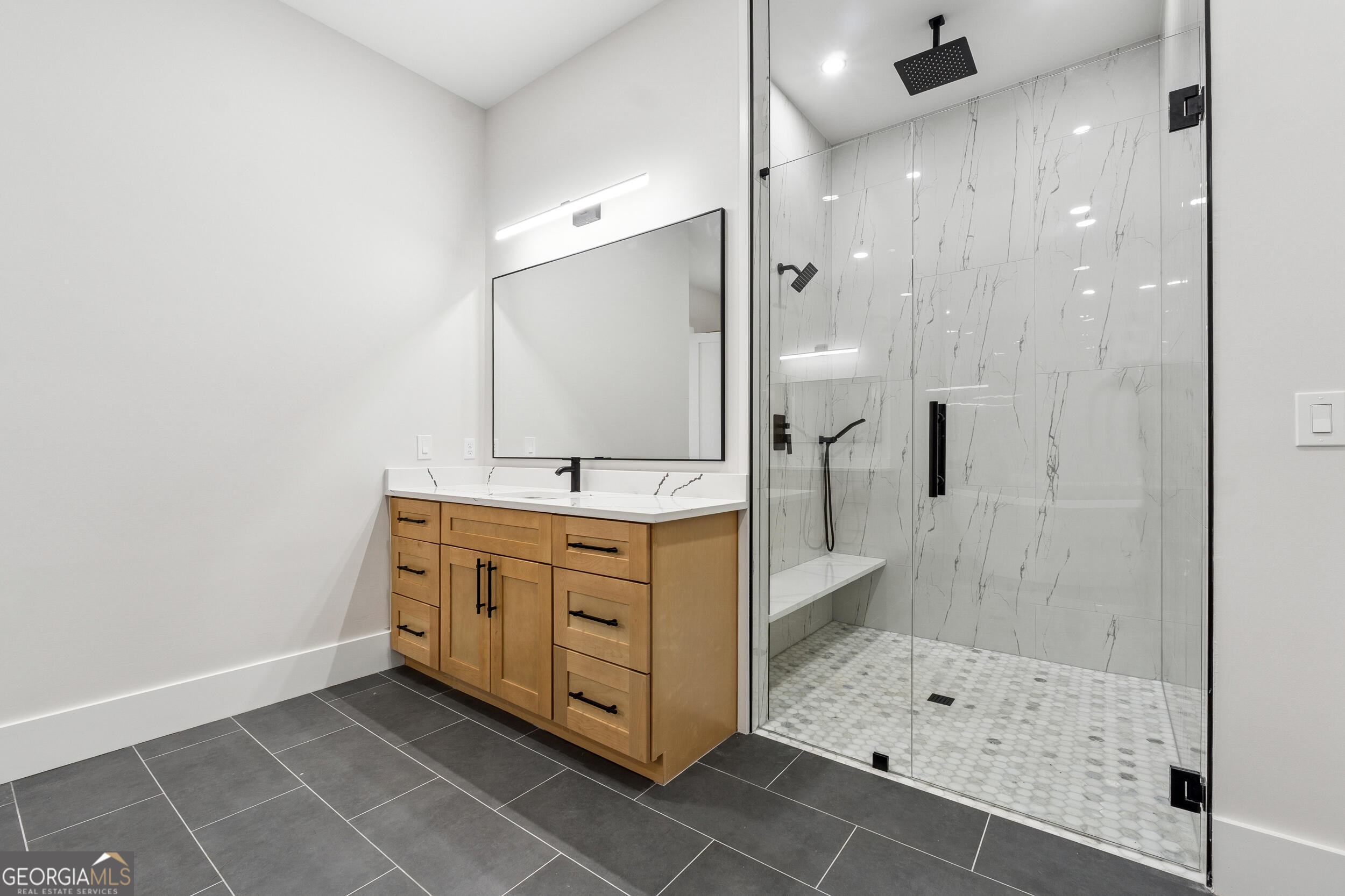 1622 Double Springs Monroe, GA 30656 - Photo 22 of 44 a bathroom with a shower sink and mirror