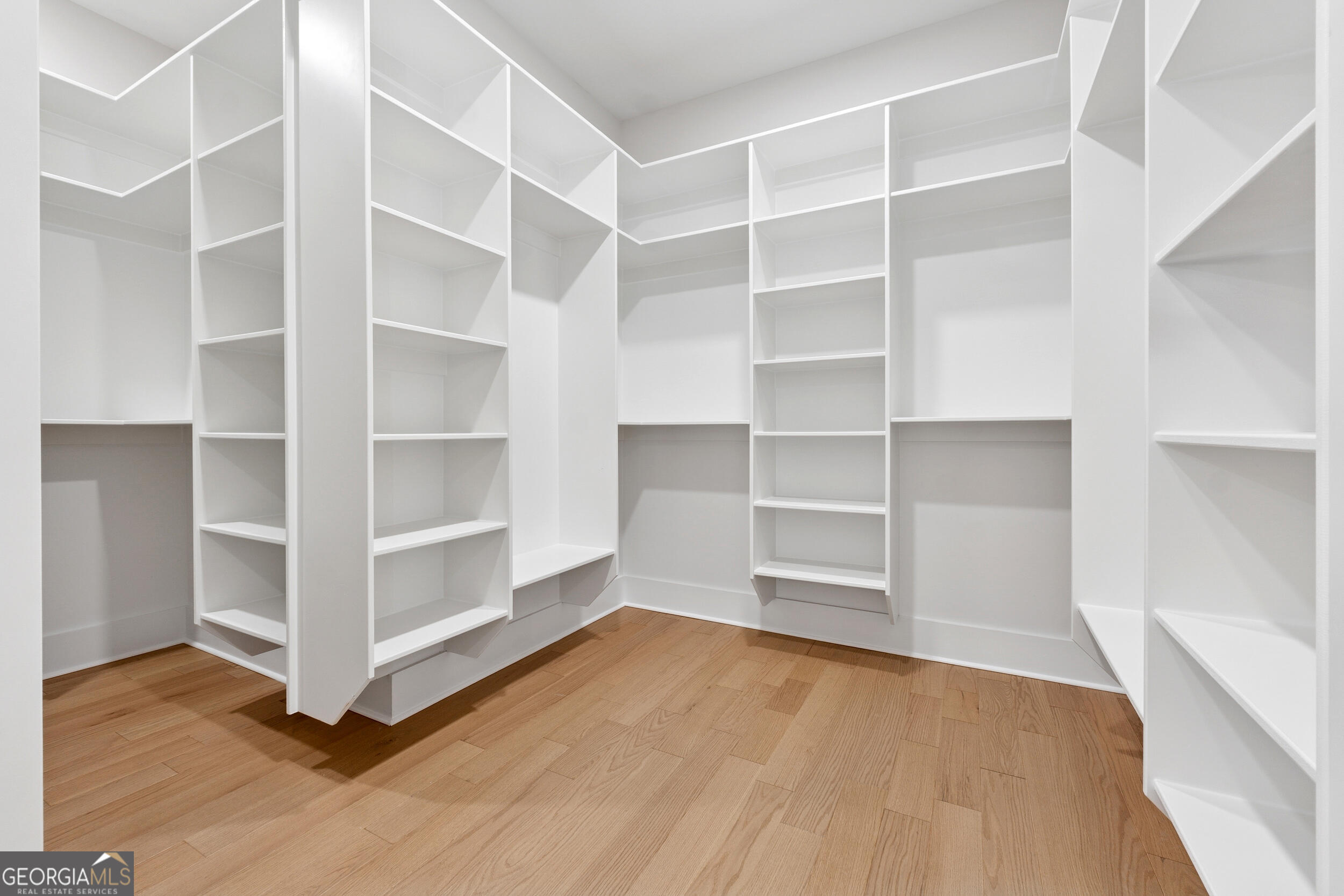1622 Double Springs Monroe, GA 30656 - Photo 24 of 44 a view of an empty room with wooden floor and closet