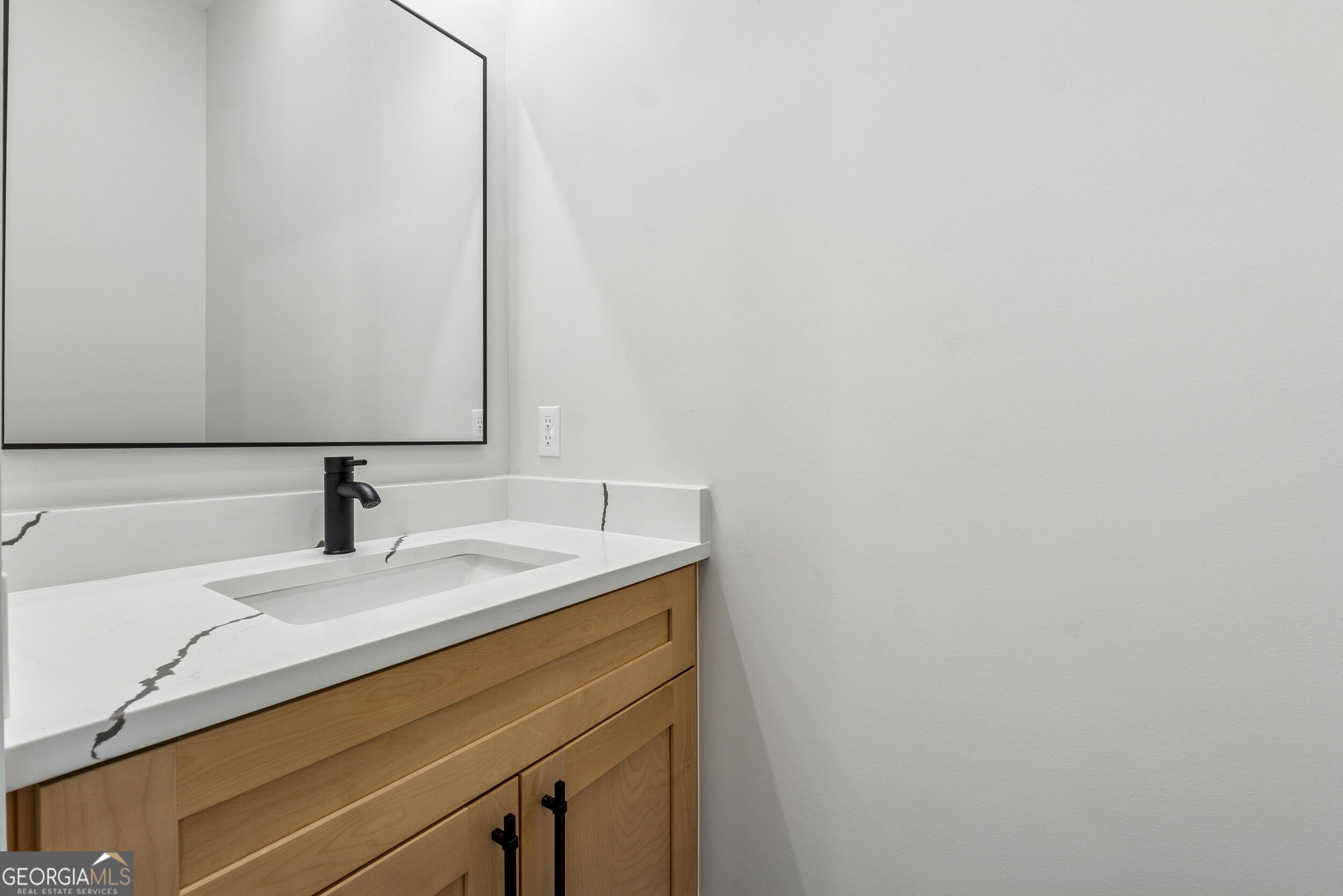 1622 Double Springs Monroe, GA 30656 - Photo 27 of 44 a close up of a sink and a mirror