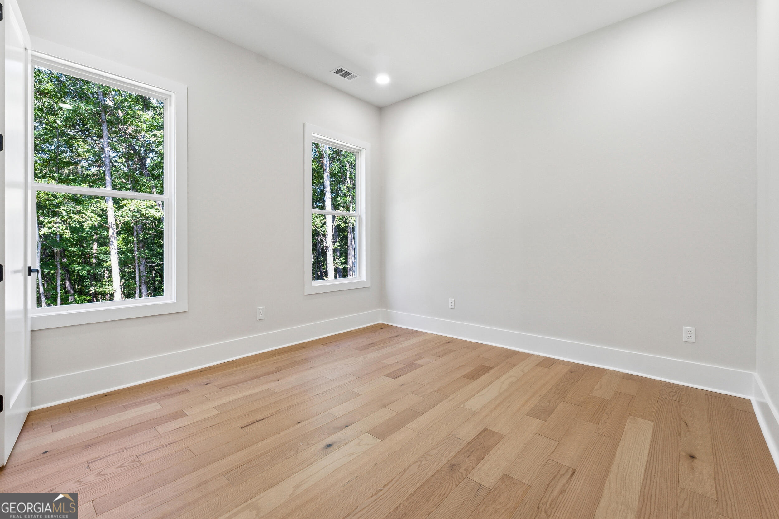 1622 Double Springs Monroe, GA 30656 - Photo 28 of 44 a view of an empty room with wooden floor and a window