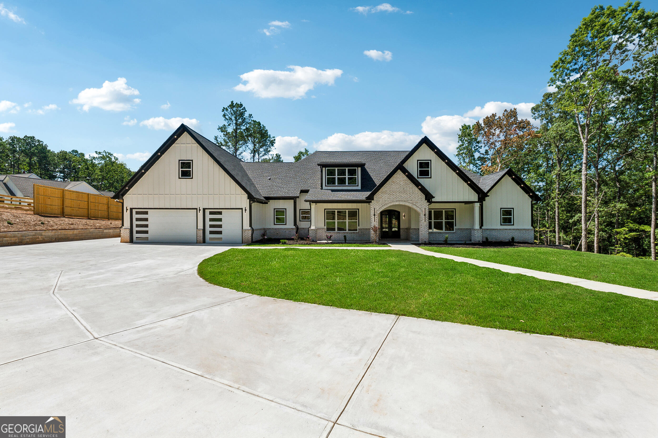 1622 Double Springs Monroe, GA 30656 - Photo 4 of 44 a front view of a house with a yard and garage