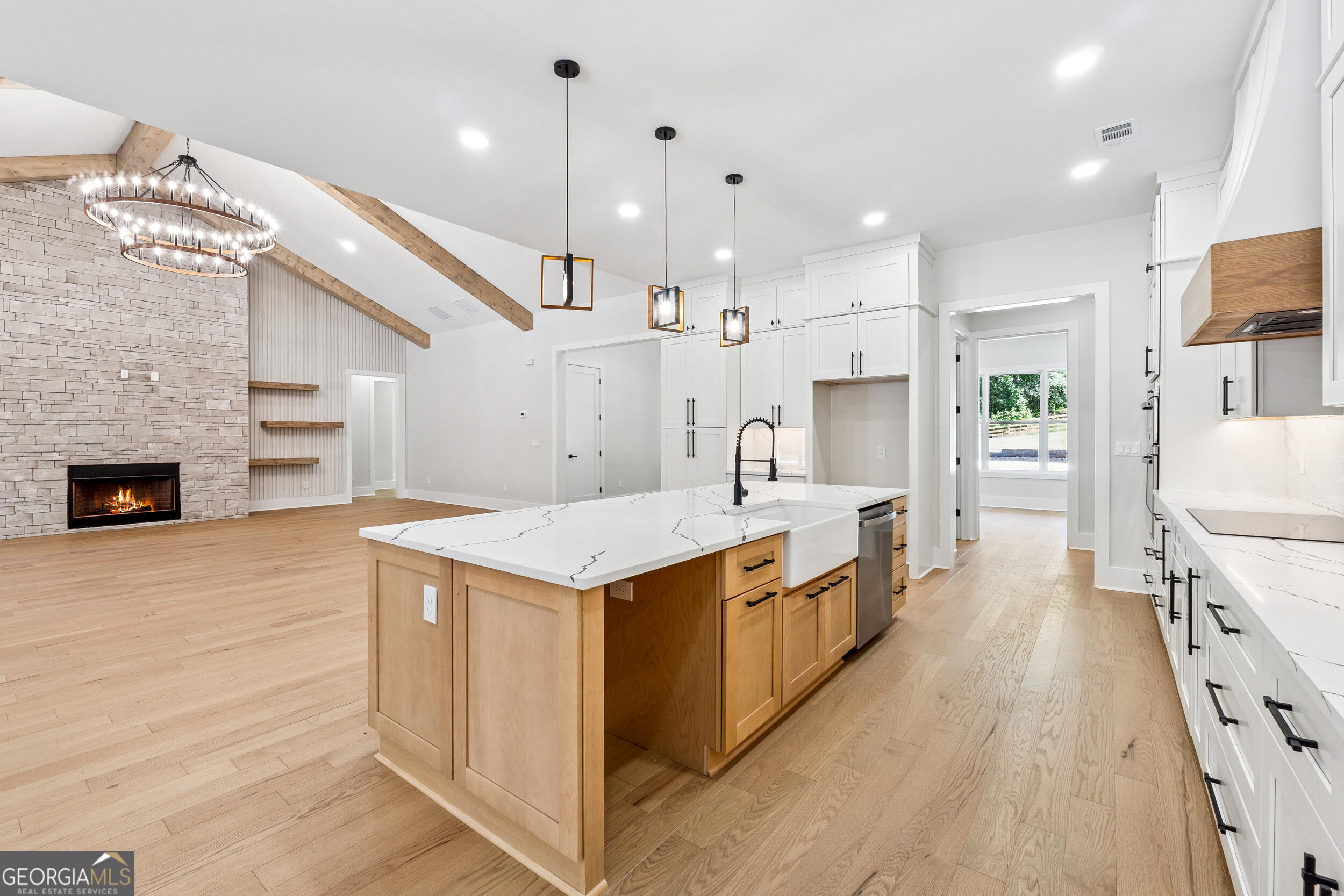 1622 Double Springs Monroe, GA 30656 - Photo 10 of 44 a large kitchen with stainless steel appliances kitchen island wooden cabinets and a stove