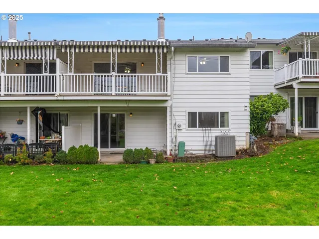 a front view of house with yard and outdoor seating
