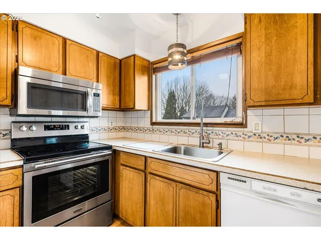 a view of a room with wooden walls