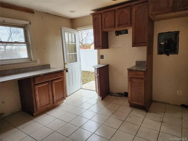 a kitchen with stainless steel appliances a refrigerator and a stove top oven