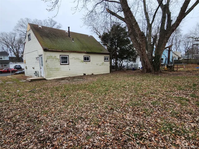 a view of a house with a tree