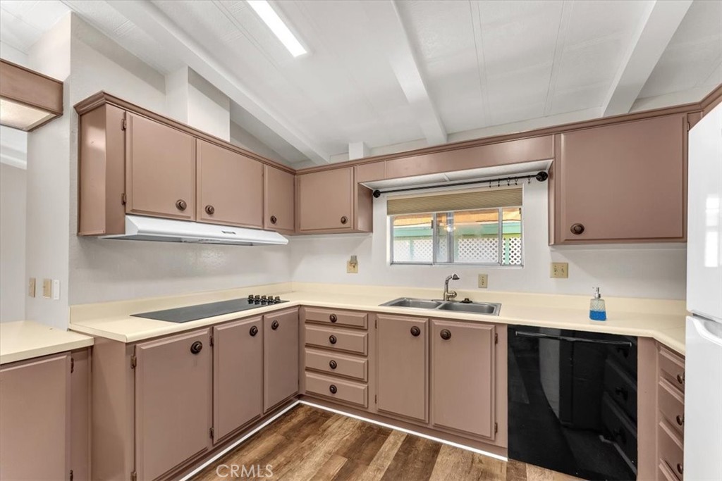 350 Gilmore Road, Unit 16 Red Bluff, CA 96080 - Photo 15 of 35 a kitchen with a sink cabinets and window