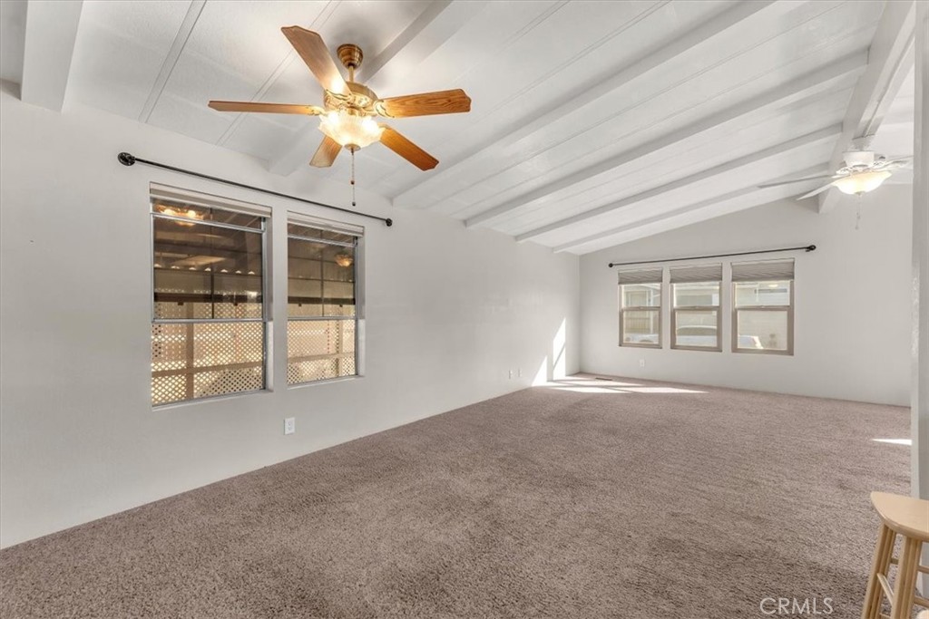 350 Gilmore Road, Unit 16 Red Bluff, CA 96080 - Photo 18 of 35 an empty room with windows and ceiling fan