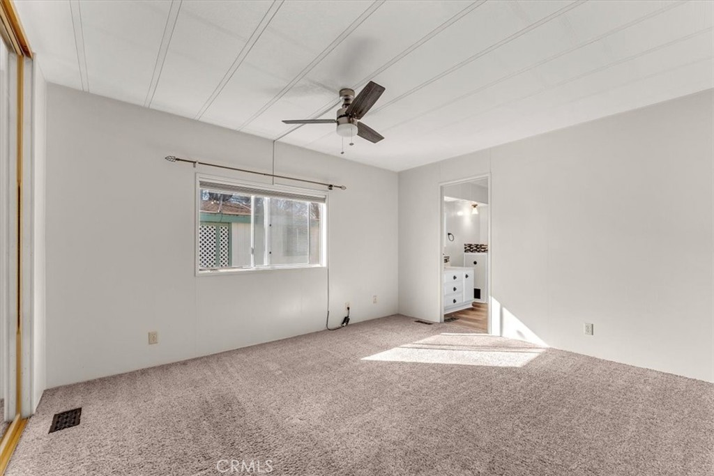 350 Gilmore Road, Unit 16 Red Bluff, CA 96080 - Photo 21 of 35 wooden floor in an empty room with a window