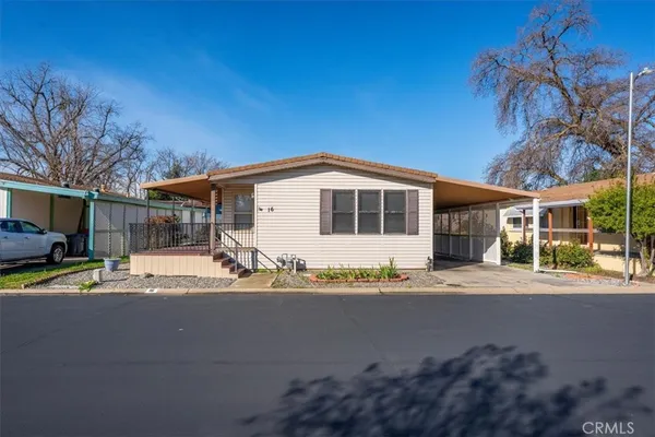 a view of a house with a outdoor space and porch