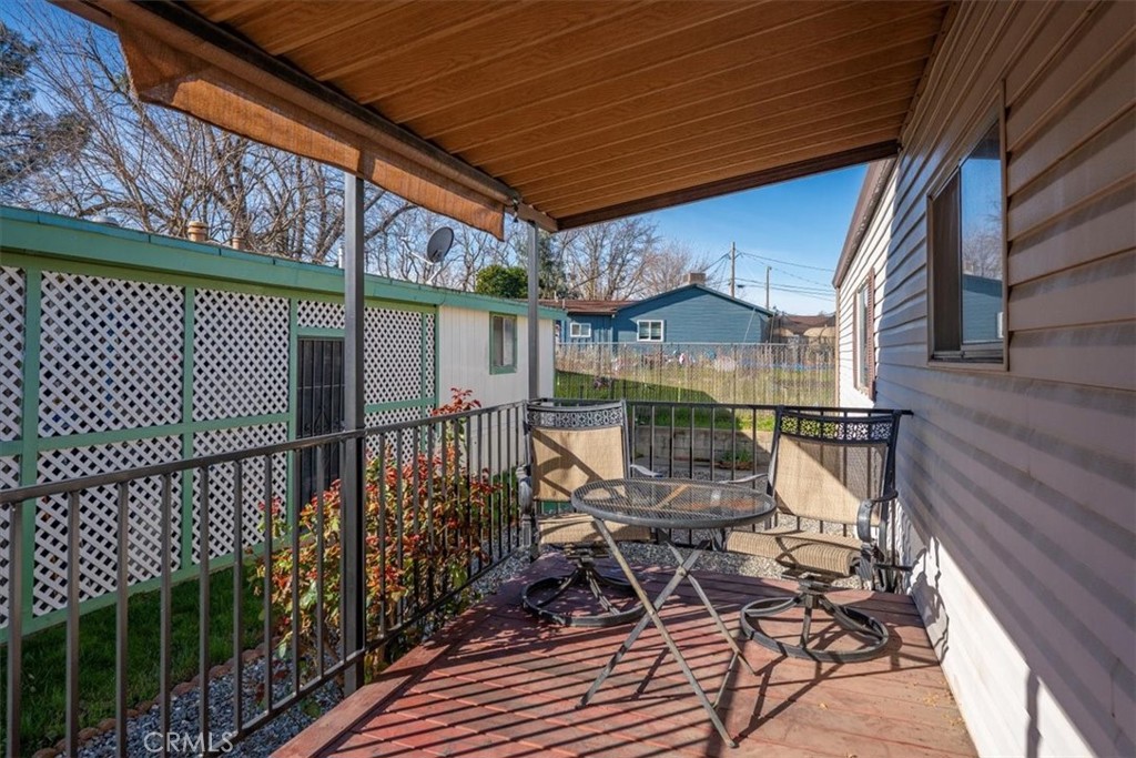 350 Gilmore Road, Unit 16 Red Bluff, CA 96080 - Photo 5 of 35 a view of balcony with wooden floor and outdoor seating