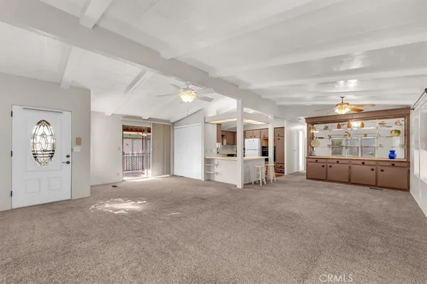 a view of a big room with closet and windows