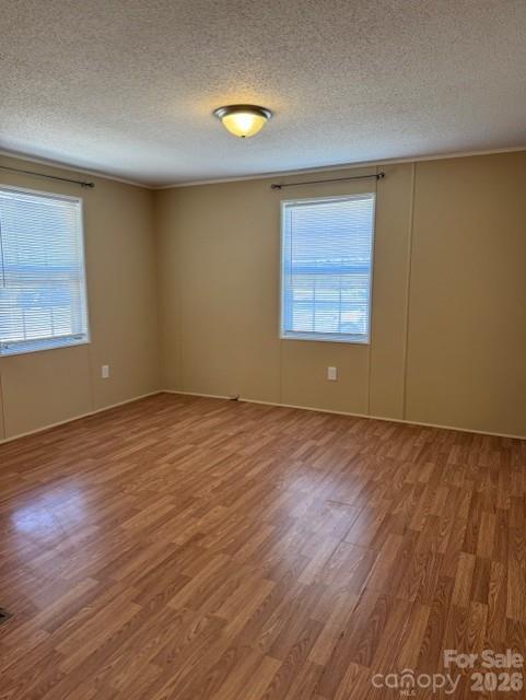 3876 Will Proctor Street Denver, NC 28037 - Photo 8 of 14 an empty room with wooden floor and windows