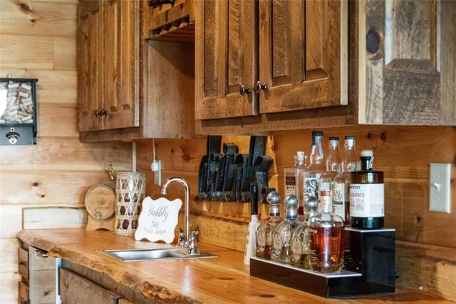 a view of a yard with wooden fence