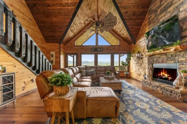 a living room with furniture a window and a fireplace