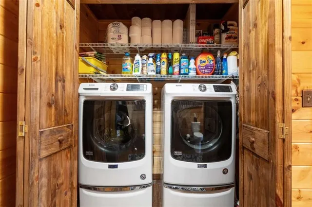 a bedroom with a bed next to a window