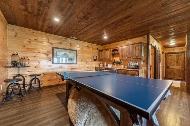 a balcony with furniture and a fireplace