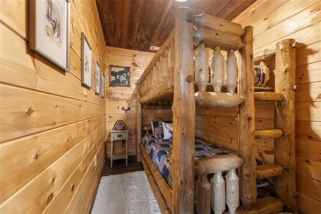 a spacious bedroom with a bed and a large window