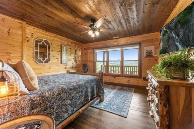 a bedroom with bed couch and dresser