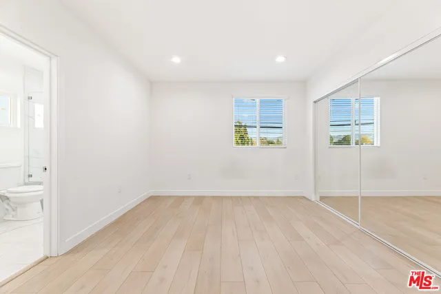 a bathroom with a double vanity sink toilet and shower