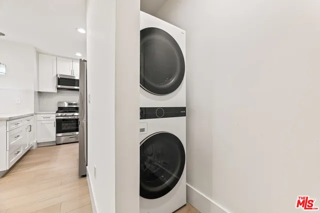 a kitchen with a refrigerator a sink and a stove