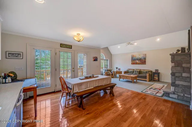 a living room with furniture a rug and a large window