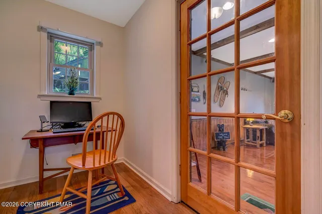 a workspace with furniture and a window