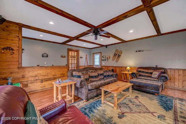 a living room with lots of furniture and a rug