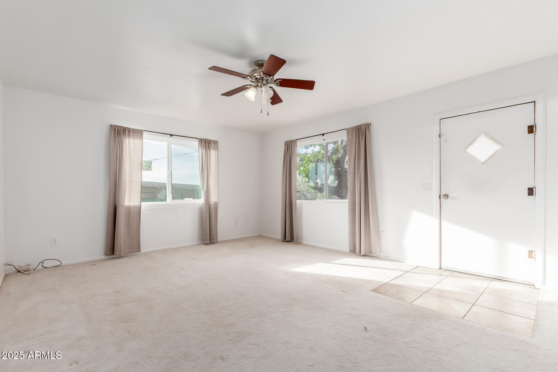 845 West Spray Street Superior, AZ 85173 - Photo 15 of 29 a view of a livingroom with a ceiling fan and window