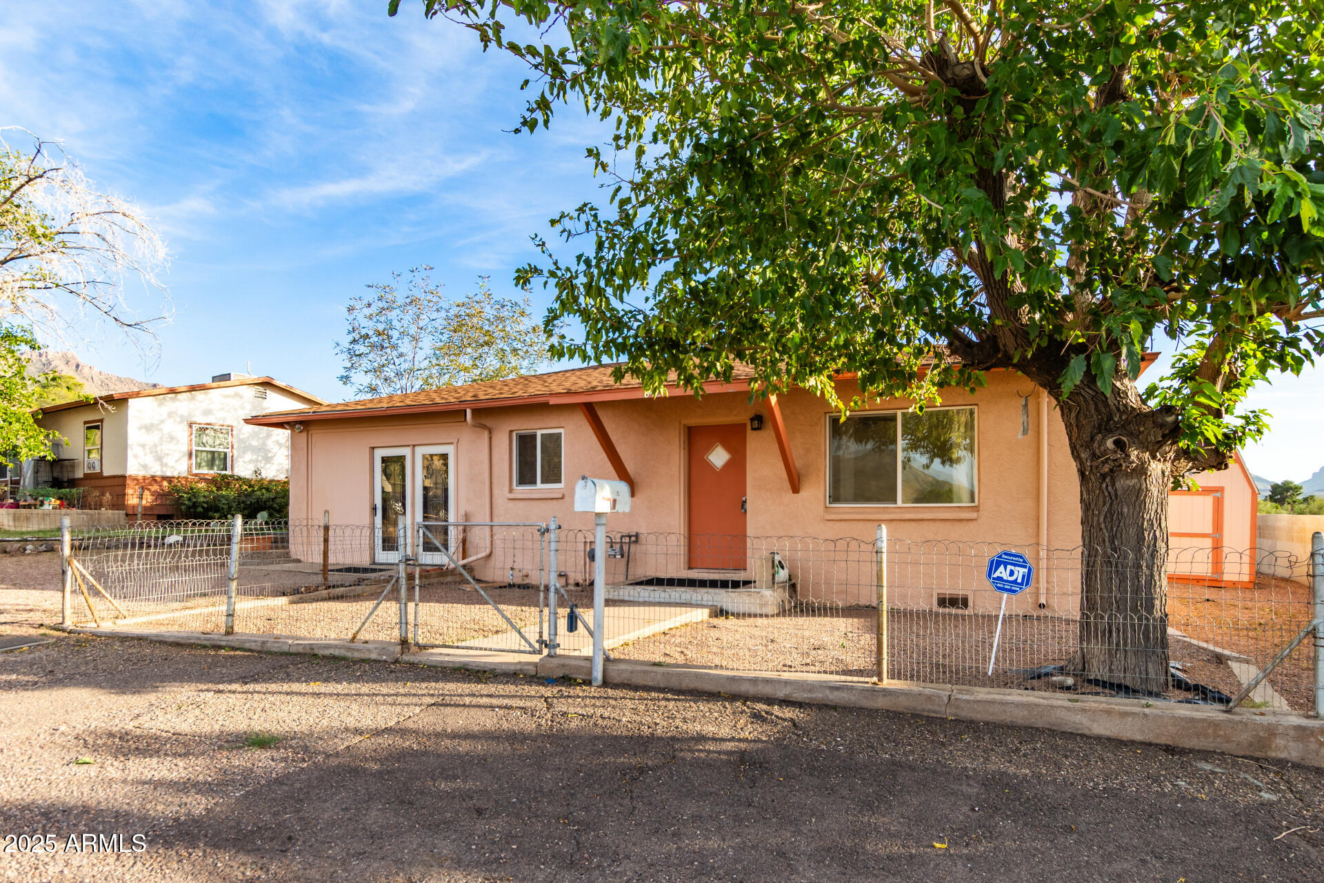 845 West Spray Street Superior, AZ 85173 - Photo 8 of 29 a front view of a house with a tree