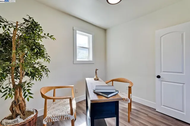 wooden floor with a table and chairs in wooden floor