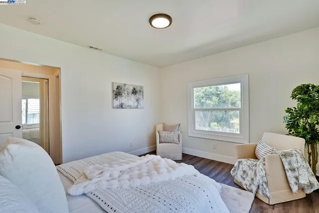 a bathroom with a granite countertop sink a toilet and shower